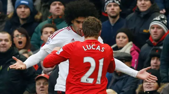 Marouane Fellaini and Luca Leiva