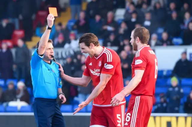 Aberdeen defender Mark Reynolds is shown a red card