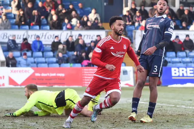 Shay Logan celebrates after scoring for Aberdeen against Ross County