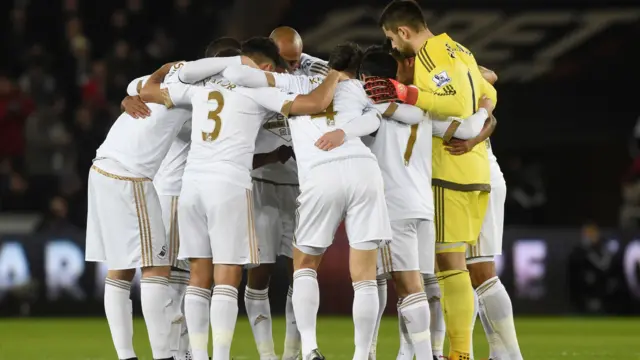 Swansea's players huddle