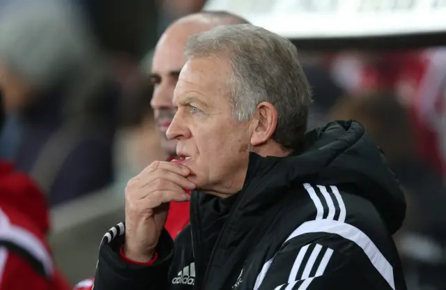 Alan Curtis looks on