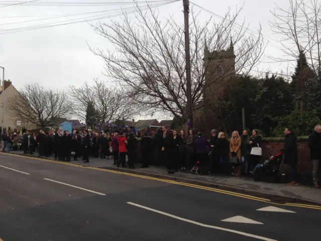 Mourners lining the street