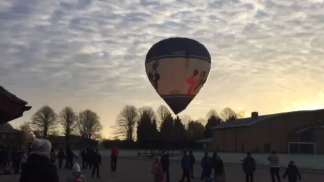 Hot air balloon arriving in Bassingbourn