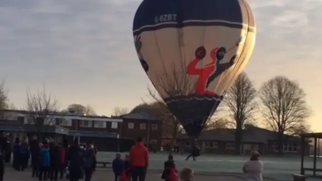 Hot air balloon lands at Bassingbourn Primary School