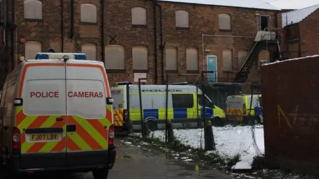 Police vans in Derby