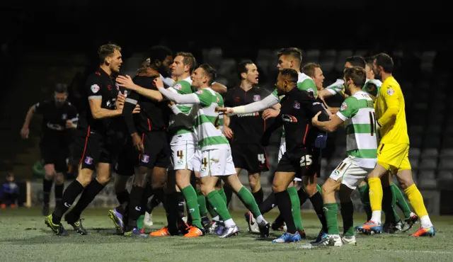 Yeovil players confront Carlisle players