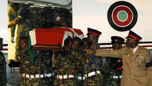 Members of the Kenya Defence Forces carry the casket of a comrade serving in the African Union Mission in Somalia (AMISOM)