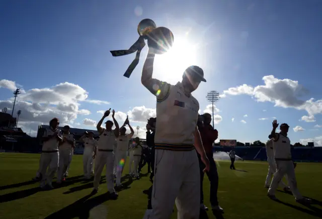 Yorkshire's Andrew Gale raises the County Championship trophy at Headingley