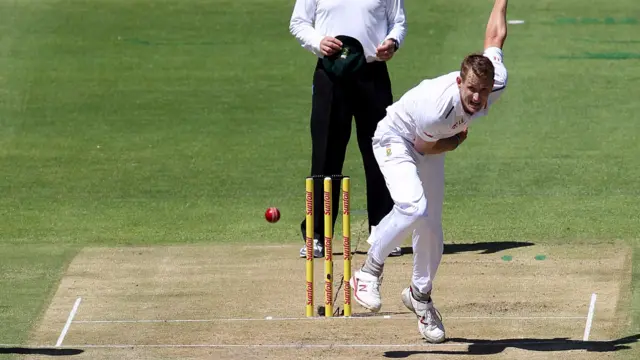 Chris Morris bowls to Alastair Cook