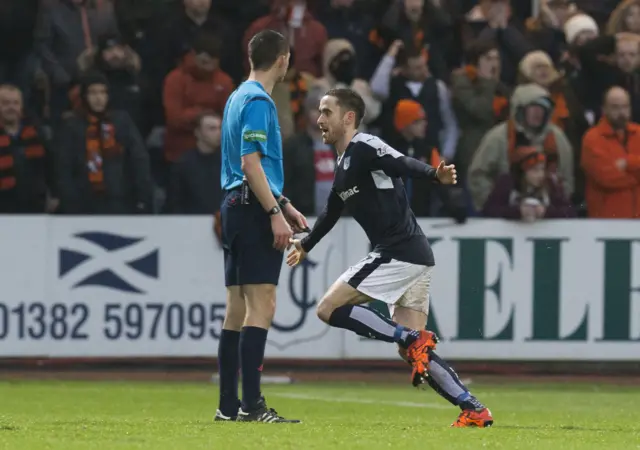 Nicky Ross celebrates after scoring for Dundee against Dundee United