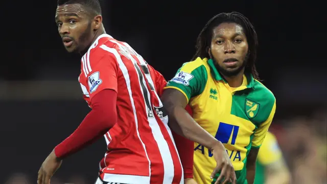 Dieumerci Mbokani of Norwich City and Cuco Martina of Southampton