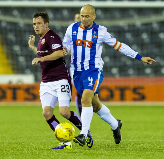 Hearts' Danny Swanson (left) is tackled by Jamie Hamill