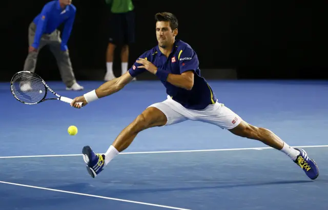 Novak Djokovic stretches