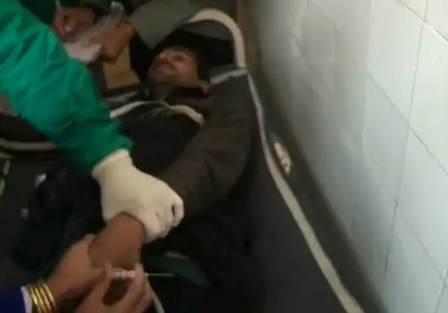 Medical officers attend to a man injured in a militant attack at Bacha Khan University, at a hospital in Charsadda