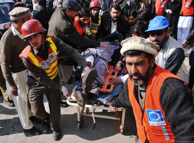 Pakistani rescuers shift an injured man to a hospital following an attack by gunmen in the Bacha Khan university in Charsadda, about 50 kilometres from Peshawar, on 20 January 2016.