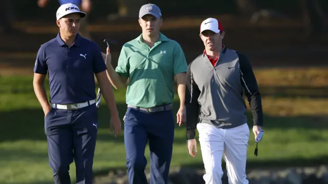 Rickie Fowler (left), Jordan Spieth and Rory McIlroy in round one in Abu Dhabi