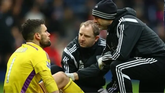 Ben Foster being seen by medical team