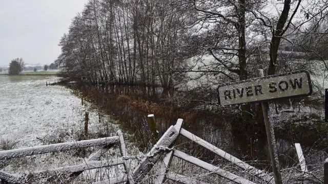 Frosty River Sow sign over river