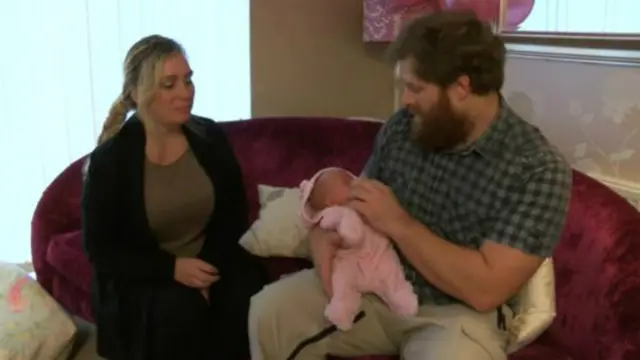 Baby Evie with her parents