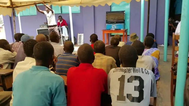 People at viewing centre in Uganda