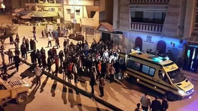 Egyptians medics and people gathering at the site of attack on a mobile checkpoint in Arish, Egypt