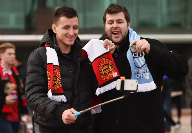 Fans taking photos outside of the Manchester derby