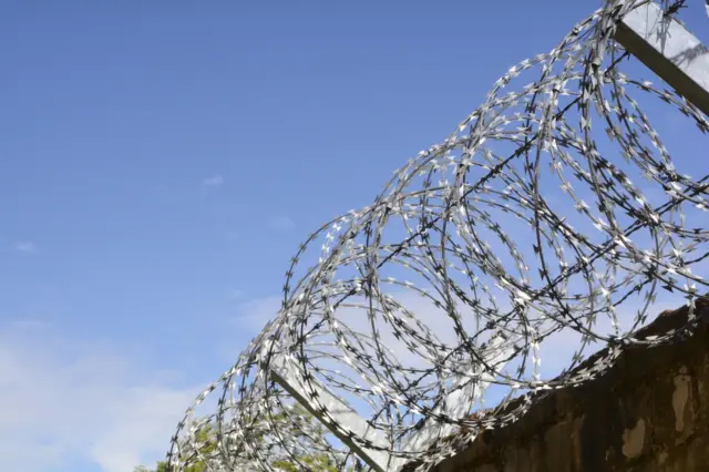 Wire on prison wall