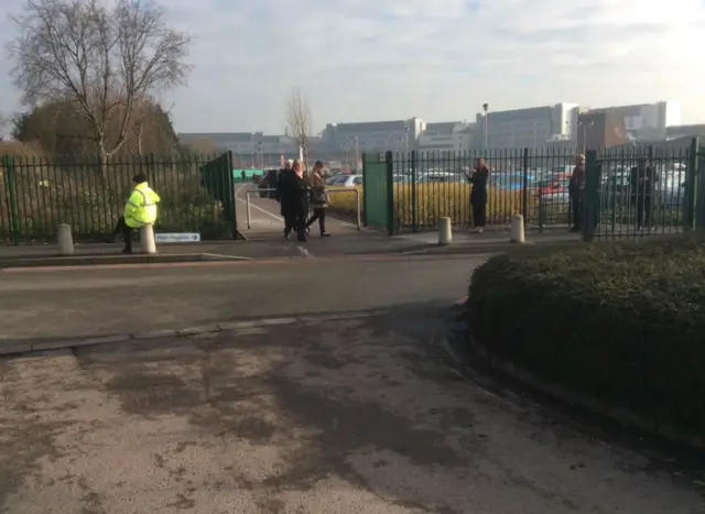 Smokers outside the gates of Coventry University Hospital