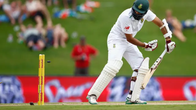 Hashim Amla is bowled out