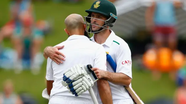 Hashim Amla celebrates his 100 with Stephen Cook