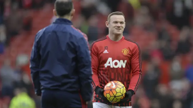 Wayne Rooney warms up