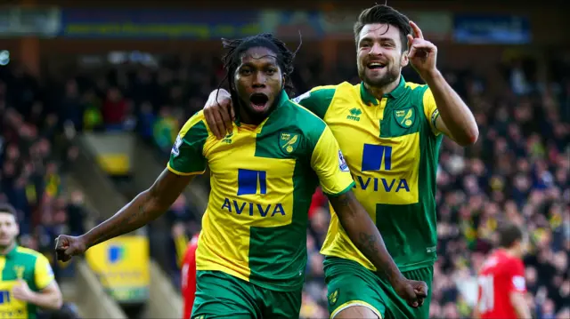 Dieumerci Mbokani celebrates