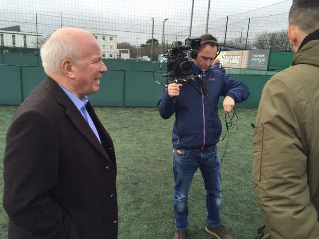 Greg Dyke and Nick Bright being filmed on 5-a-side pitch