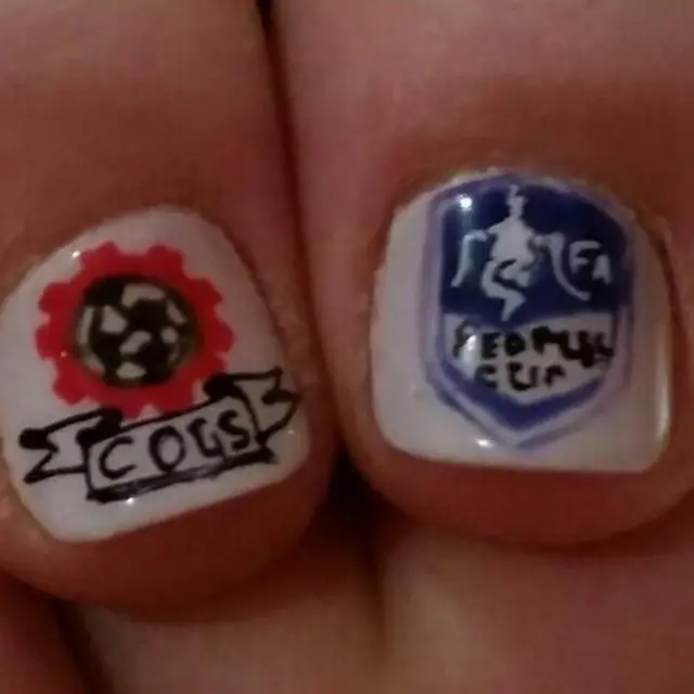 Fingernails painted with logos