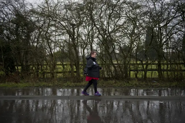 Jo walking through water