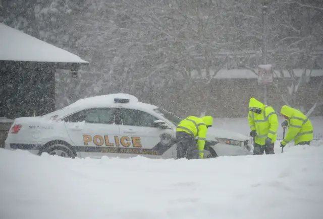 A Capitol police car stuck in snow