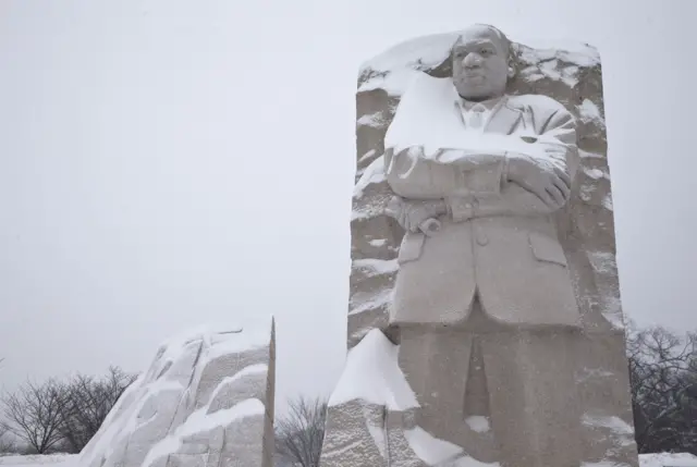 The Martin Luther King, Jr. Memorial is seen with a coating of snow, Saturday, Jan. 23, 2016 in Washington