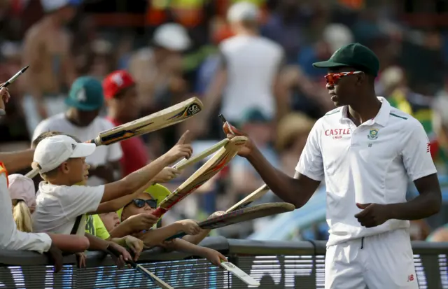 Kagiso Rabada signs autographs