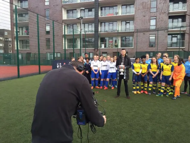 BBC crew filming Nick Bright with the FA Cup and girls football teams