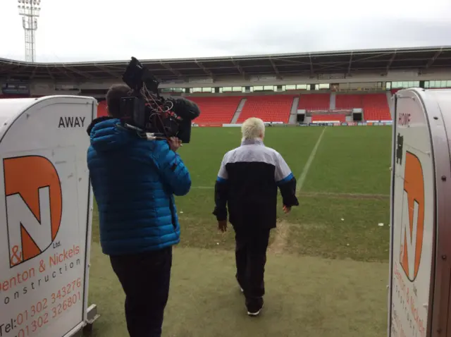 Jan Milner walking out on football pitch