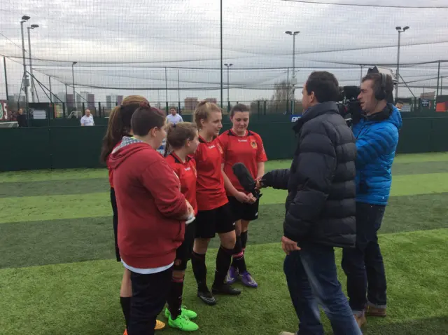 BBC crew filming girls football team on a 5-a-side pitch