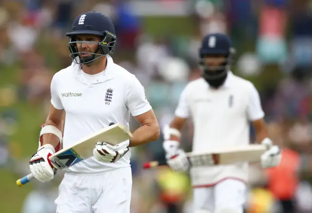 Moeen Ali and James Anderson leave the field