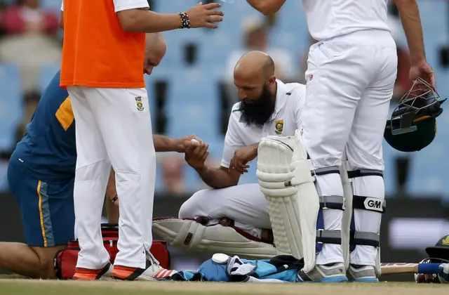 Hashim Amla of South Africa receives treatment