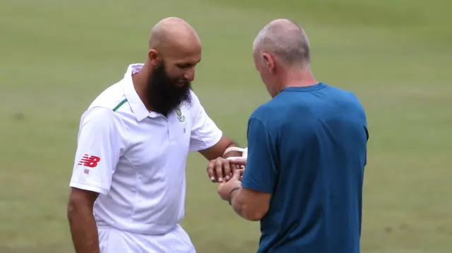 Hashim Amla receives treatment