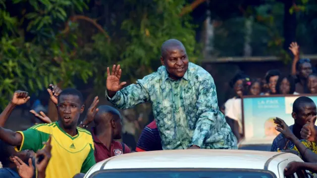 This file photo taken on December 28, 2015 shows Central African presidential candidate Faustin Archange Touadera waving to supporters during a presidential campaign tour in Bangui