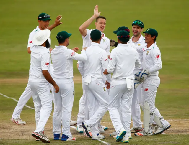 South Africa's players celebrate the wicket of Alastair Cook