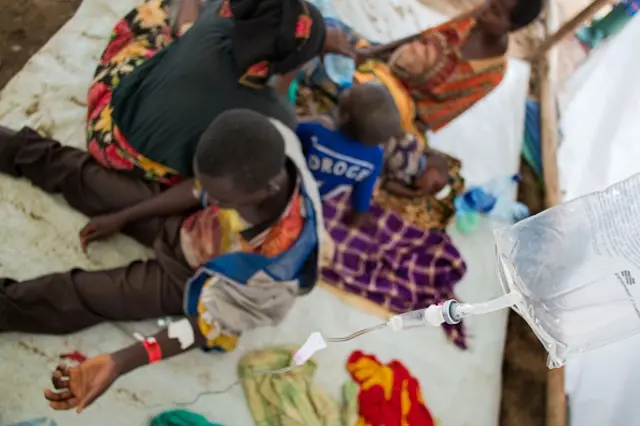 People receive medical treatment in the fishing village of Kagunga in Tanzania