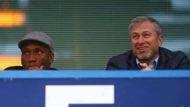 Didier Drogba (L) and Chelsea owner Roman Abramovich