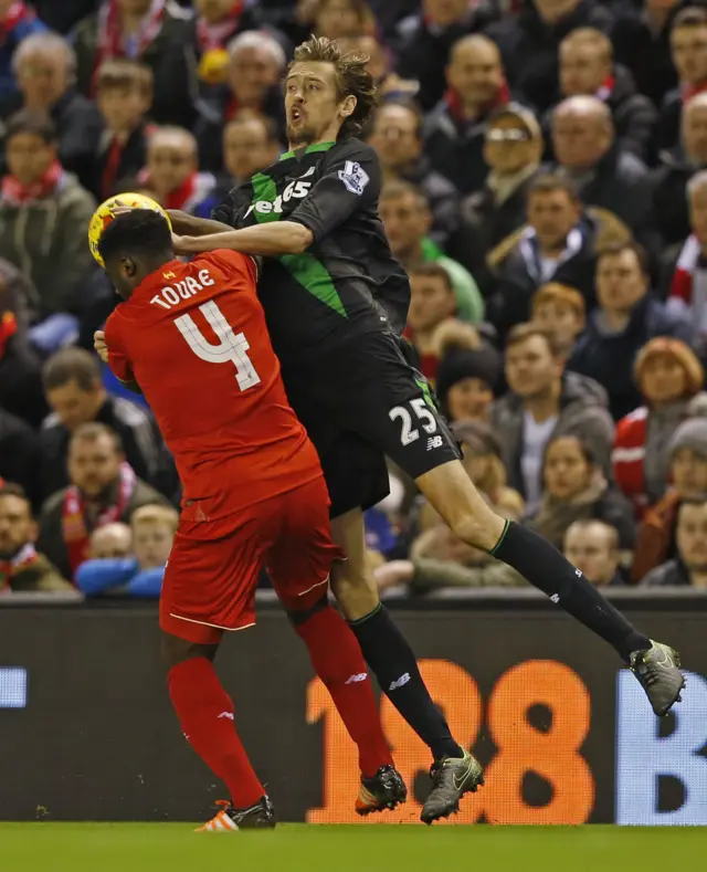 Kolo Toure challenges Peter Crouch