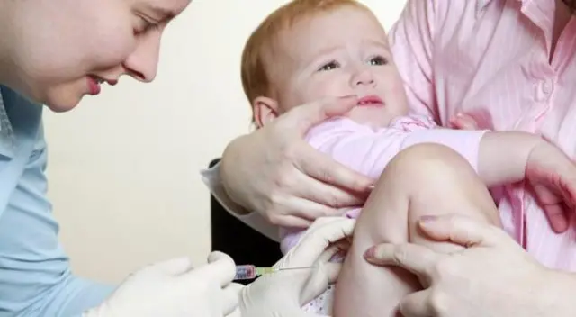 Nurse performing MMR vaccination